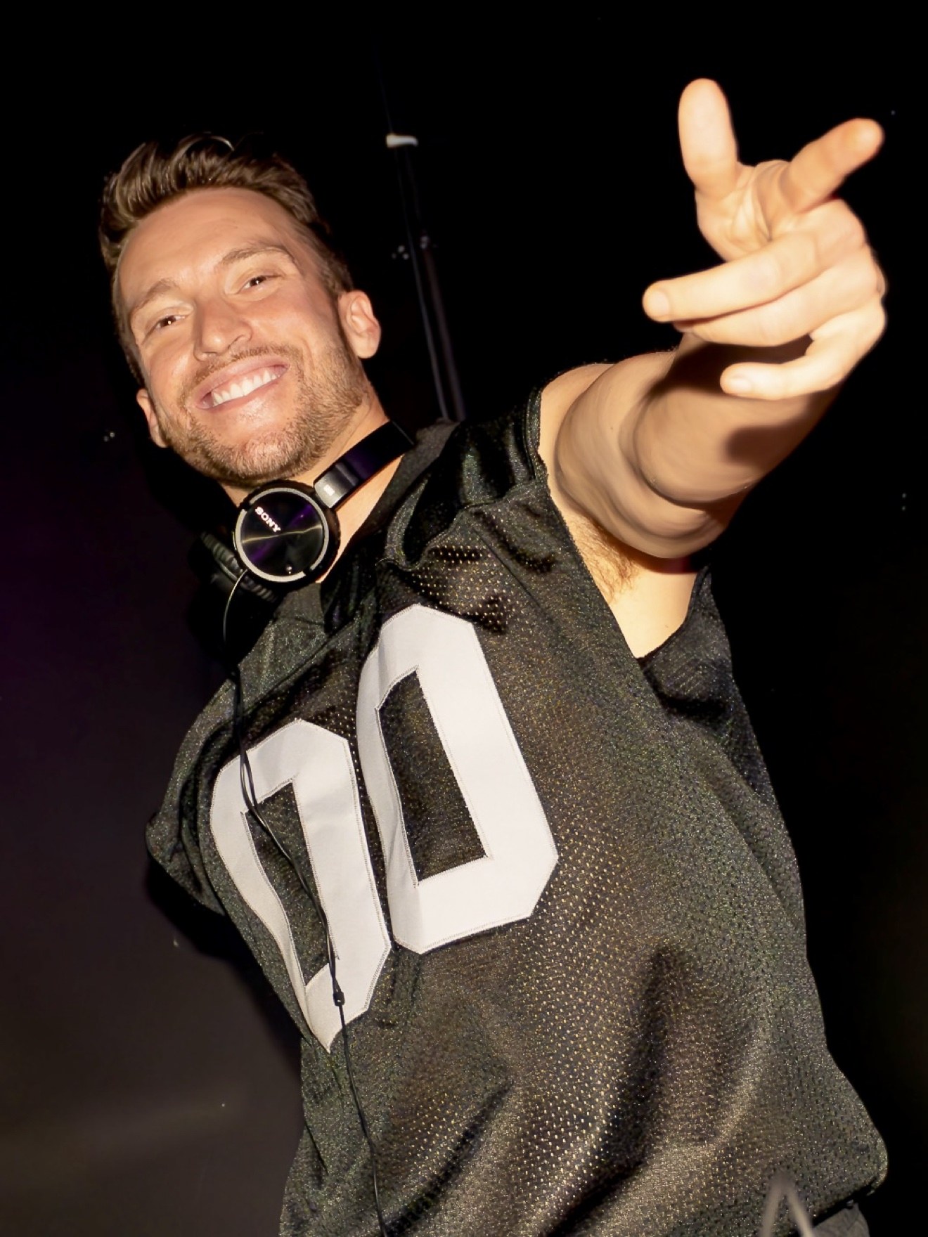 MURFF pointing at the camera, smiling